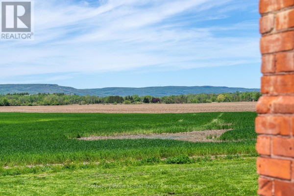 Expansive green fields and rolling hills under a blue sky - 1952 Nottawasaga N Clearview