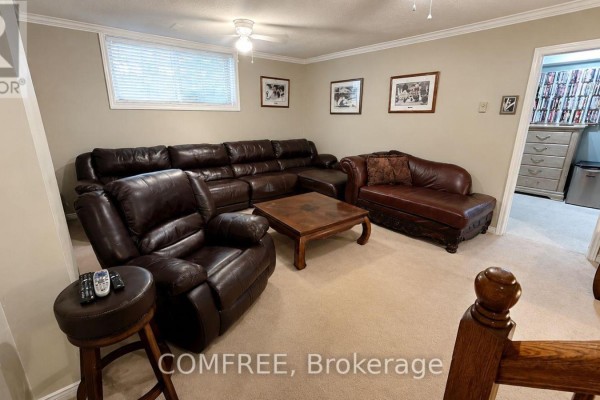 Leather sectional and recliner in living room - 1960 Rolling Brook Drive Ottawa