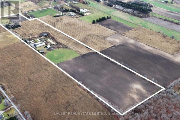 Aerial view of a farm with fields, outbuildings, and property lines indicated. - 19654 Mccowan Road, East Gwillimbury