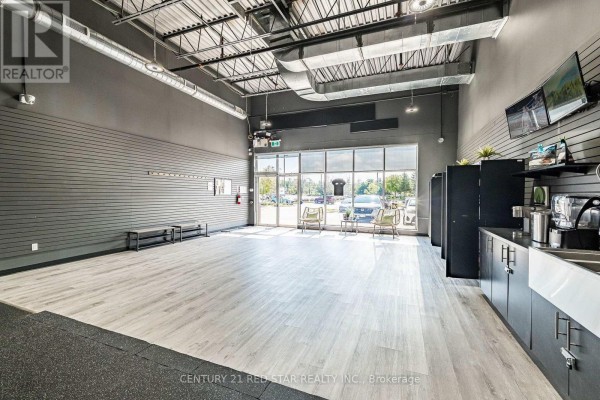 Interior of retail space with product displays and a service counter - 1b - 1 Market Lane, Wasaga Beach