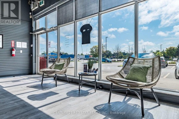 Retail area featuring shelves of supplements and a large window - 1b - 1 Market Lane, Wasaga Beach