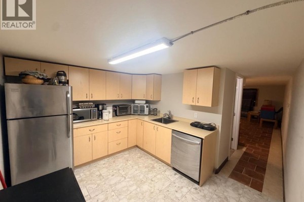 Compact kitchen area with light wood cabinets, stainless steel appliances, and tile flooring. - 2, 162 Hampshire Road, Hinton