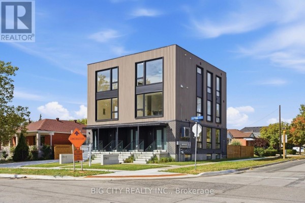 Corner view of a three-story townhouse building with contemporary finishes and large windows. - 2 - 276 Lanor Avenue, Toronto