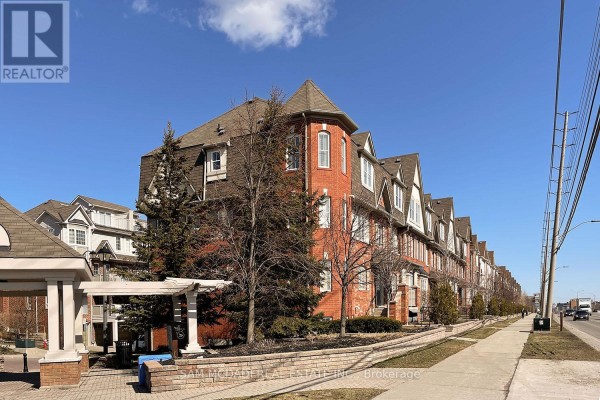Side view of brick townhouses with dormer windows and balconies. - 2 - 639 Dundas Street W, Mississauga
