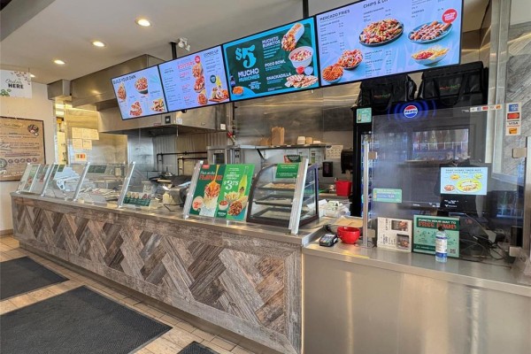 Close-up of the service counter showcasing food display and ordering screens - 2 1510 Plessis Road, Winnipeg