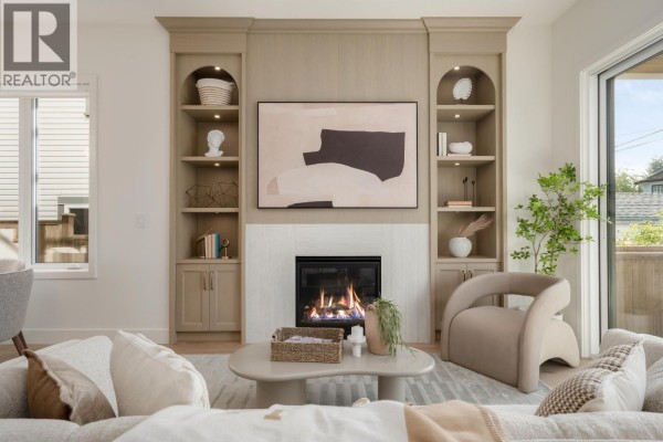 Living room fireplace with built-in shelving, contemporary furniture, and artwork above the mantel. - 2 2344 W 45th Avenue, Vancouver