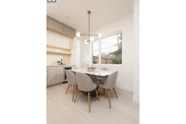 Dining area with round table, four chairs, and pendant lighting - 2 2755 W 11th Avenue, Vancouver