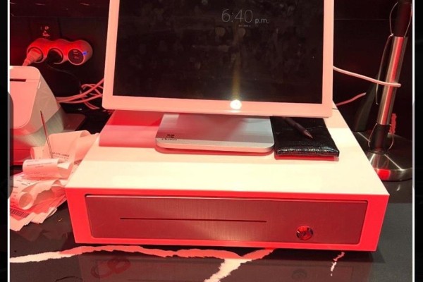 Close-up of a modern cash register with a digital display and receipt printer. - 2-3 - 5235 Steeles Avenue W, Toronto