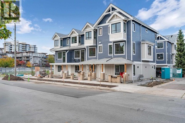 Aerial view of Ferndale Gardens townhouse complex with buildings labeled by phase and completion year. - 2 9331 Ferndale Road, Richmond