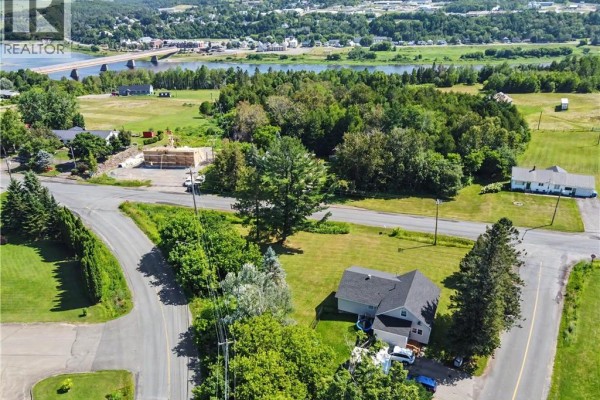 View of the house's side with air conditioning units and fenced yard. - 2 Cross Road, Somerville