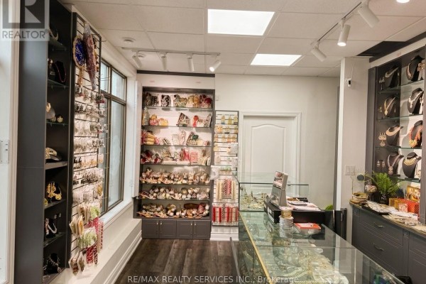 Store interior with shelves displaying various jewelry and decorative items, plus glass display counters. - 2 Davenfield Circle, Brampton