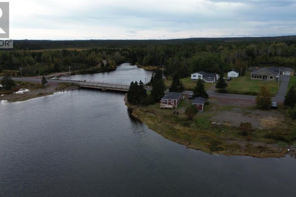 Aerial view of the property and its waterfront location, with a bridge and other houses in the background. - 2 Main Street, Northern Arm