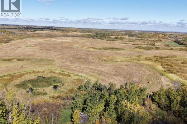 Wide aerial view of rolling farmland, with scattered trees, ponds, and crops in the distance. - 2 Quarters Mixed Use Land & Yard Site Near Sheho, Foam Lake Rm No  276