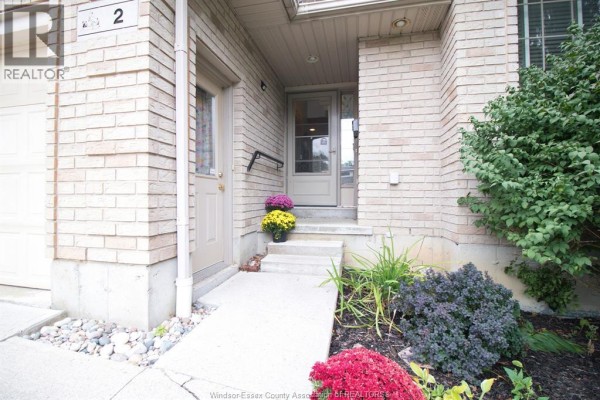 Close-up of the entrance at 2 Thomas Crescent with a brick facade and manicured lawn. - 2 Thomas Crescent, Chatham