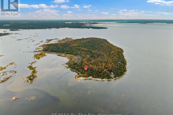 Aerial view of a large island with a small red marker, surrounded by Georgian Bay. - 20 Island 404/quarry Island, Georgian Bay