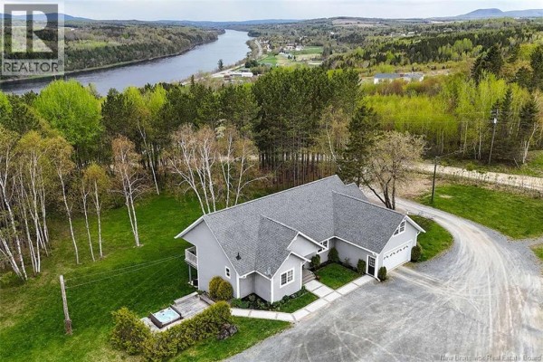 Aerial view of the property with river in the background and surrounding greenery. - 20 Left Branch Salmon Hill Road, Florenceville Bristol