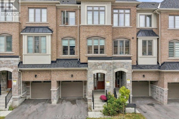 Aerial view of residential street lined with townhouses and green spaces. - 20 Nautical Way, Whitby