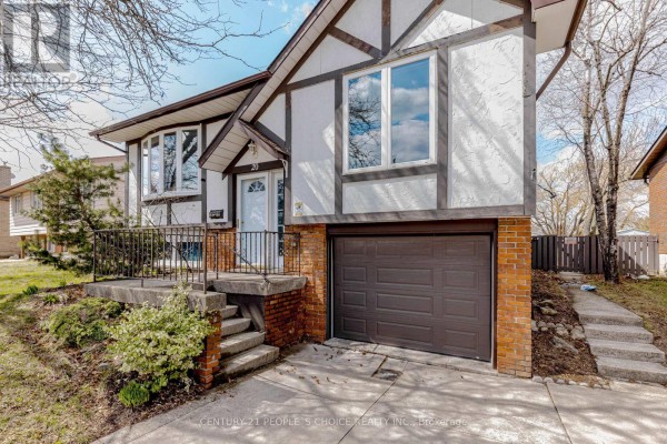 Front view of a house with a prominent garage, beige siding, and brick accents. - 20 Normajean Avenue, Hamilton