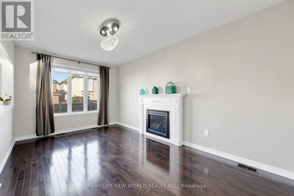 Kitchen with dark wood cabinets, stainless steel appliances including a stove and dishwasher, and light tiled floor and backsplash. - 20 Pineforest Place, Markham