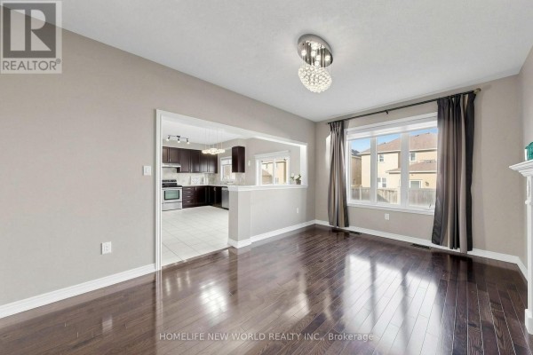 Kitchen nook with a glass table and four chairs in front of dark wood cabinets and stainless steel appliances. - 20 Pineforest Place, Markham