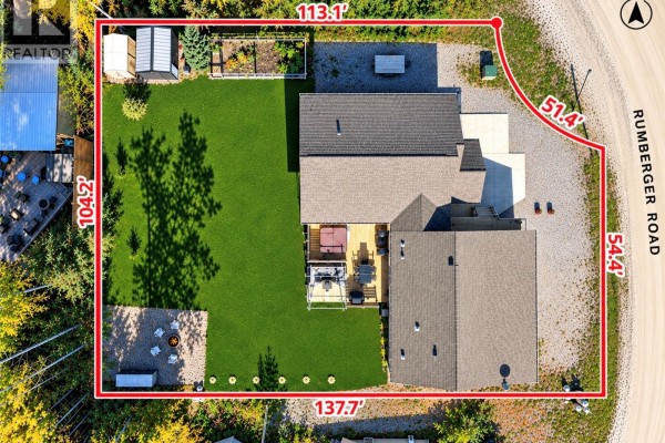Aerial view of the property at 20 Rumberger Road, Candle Lake, showing the house and yard. - 20 Rumberger Road, Candle Lake