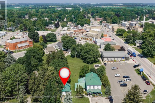 Aerial view showing the property's location within a small town setting. - 20 William Street S, Central Huron