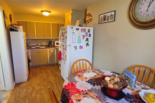Bedroom with a single bed, posters on the wall, and a laptop on the desk. - 20 Wilson Street, Marystown