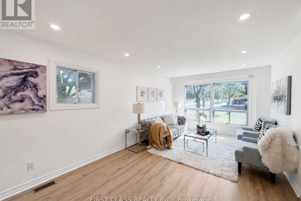 Bedroom with a king-sized bed, mirrored closet doors, and a dresser with a television. - 200 Mcnicoll Avenue, Toronto