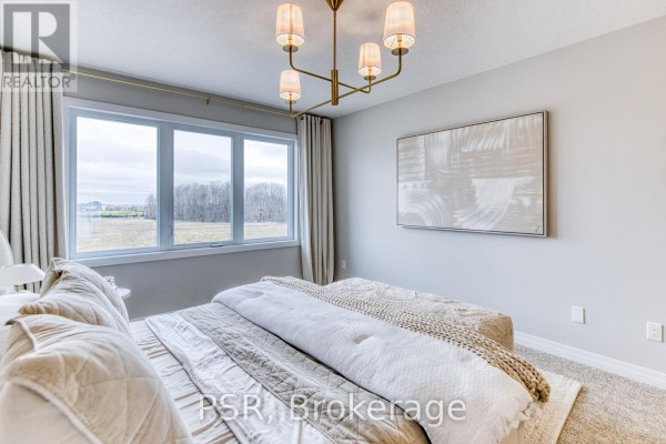 Modern bedroom with large windows and plush bed - 200 Rivergreen Crescent Waterloo