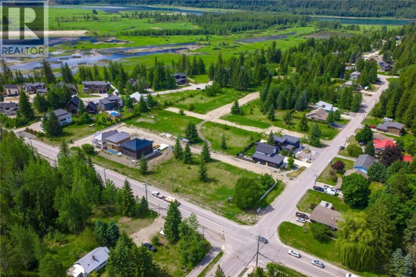 Aerial view of undeveloped and developed lots with homes and roads in a wooded area. - 2000 Lanzo Lane Lot# Sl 1, Revelstoke