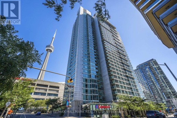 Exterior view of the apartment building with CN Tower in the background. - 2003 - 81 Navy Wharf Court, Toronto