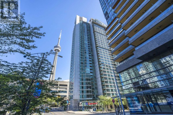 Low angle exterior view of the apartment building with CN Tower visible. - 2003 - 81 Navy Wharf Court, Toronto