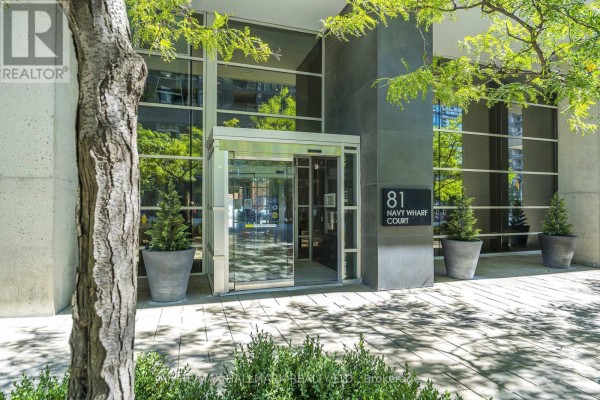 Entrance to the 81 Navy Wharf Court apartment building with modern glass doors. - 2003 - 81 Navy Wharf Court, Toronto