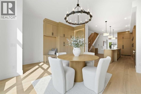 Main floor plan showing living room, pantry, kitchen, dining room, mudroom, and powder room. - 2004 51 Avenue Sw, Calgary