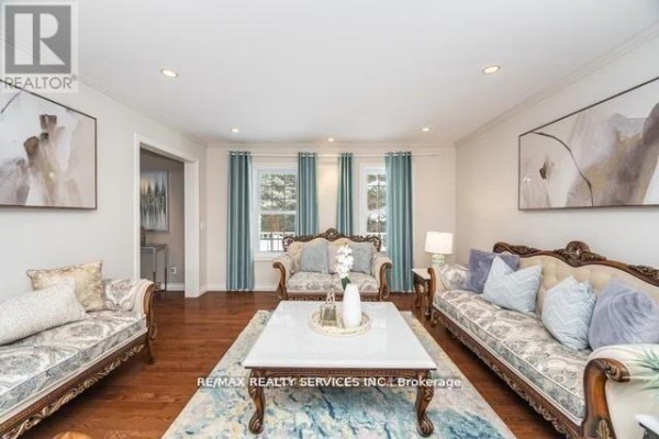 Living room with hardwood floors, recessed lighting, and windows - 20040 Kennedy Road, Caledon