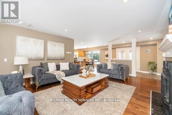 Modern living room with hardwood floors, fireplace, and open concept layout - 20040 Kennedy Road, Caledon