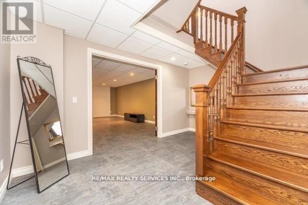 Finished basement with wood staircase, tiled floor, recessed lighting - 20040 Kennedy Road, Caledon