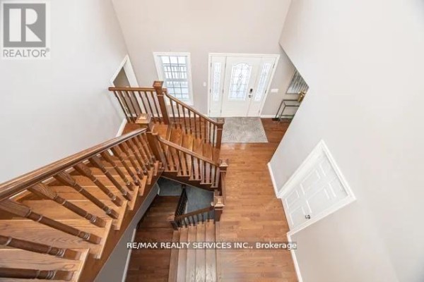 Multi-level wooden staircase, hardwood floors, double front door - 20040 Kennedy Road, Caledon
