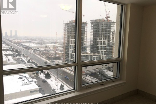 View from a window showing construction sites and city buildings. - 2005 - 9075 Jane Street, Vaughan