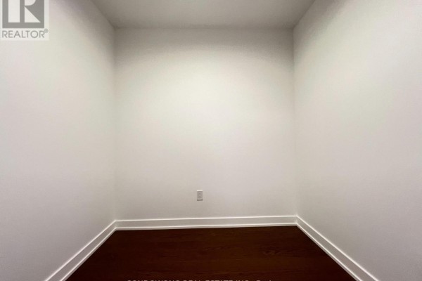 View of living area, balcony, and bathroom with tiled shower and bathtub. - 518 - 91 Montclair Avenue, Toronto