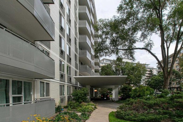 Balcony with metal railing and view of surrounding trees and buildings - 201 - 10 Shallmar Boulevard, Toronto