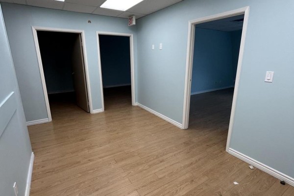Corner office featuring window, light blue walls, and laminate flooring - 201 - 10132 Yonge Street, Richmond Hill