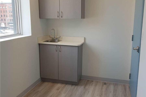 Floor plan of a commercial medical office with exam rooms and waiting area. - 102 - 26 Dalhousie Street, Toronto