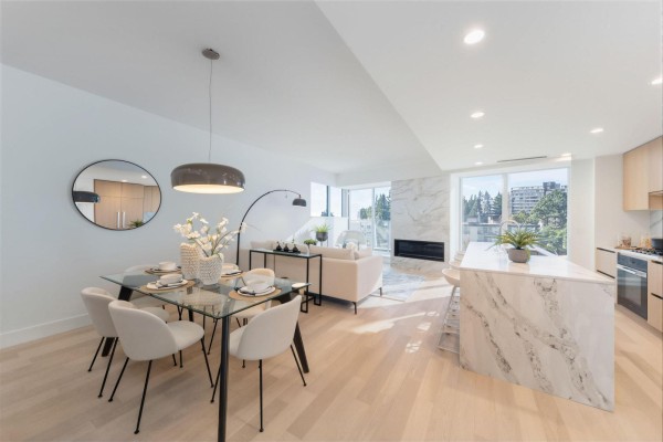Bright kitchen featuring large window, light wood cabinets, and stainless steel appliances. - 201 1475 Foster Street, Surrey