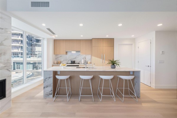 Open living and dining area with glass dining table, modern decor, and large windows. - 201 1475 Foster Street, Surrey