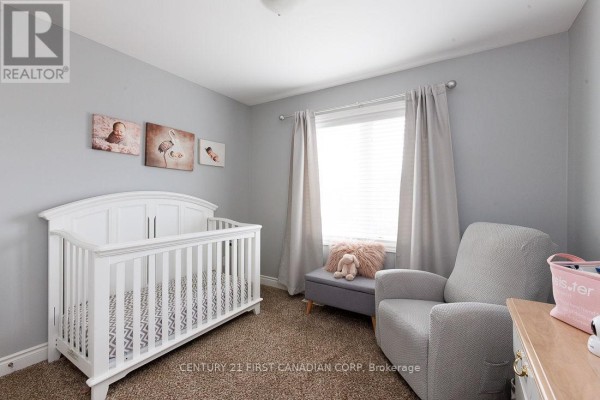 Nursery room with crib, armchair, and baby-themed decor - 2014 Ballymote Avenue London North