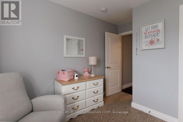 Bedroom with armchair, dresser, mirror, and framed art - 2014 Ballymote Avenue London North