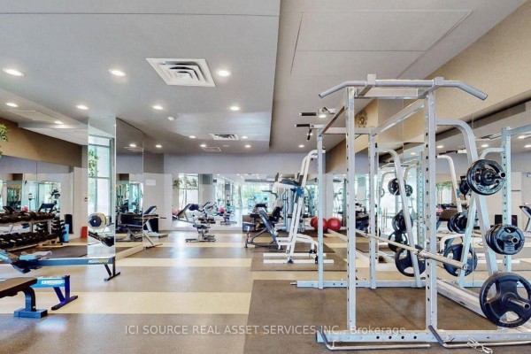 Weight room with weight racks, benches, and free weights. - 2019 - 230 Queens Quay W, Toronto