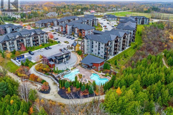 Aerial view of the apartment complex and surrounding forest in Blue Mountains. - 202 - 18 Beckwith Lane, Blue Mountains