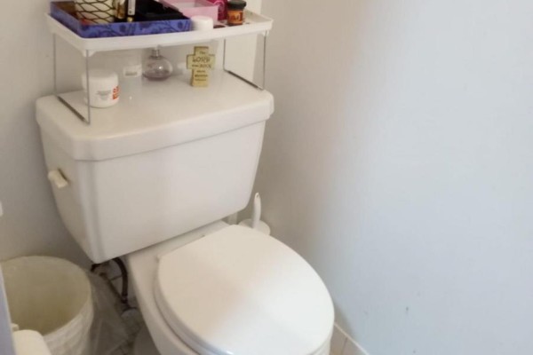 Toilet area with storage shelf and white walls - 202 - 25 Sunrise Avenue, Toronto
